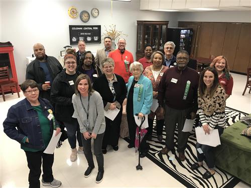 large group of adults in teacher's lounge